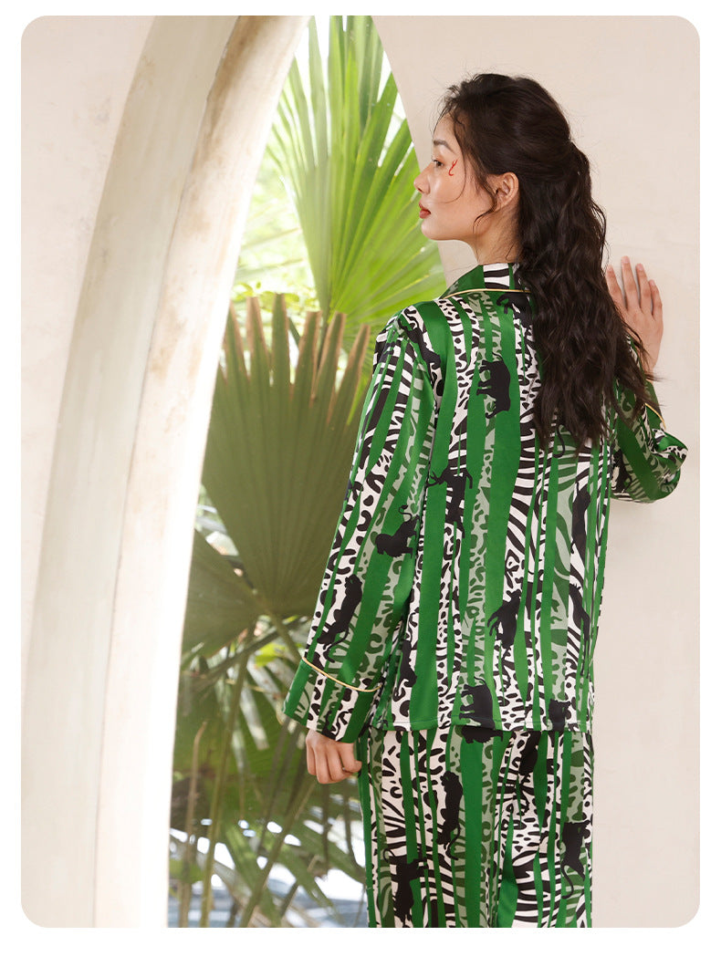 Folded silk suit set highlighting the oasis print fabric texture
