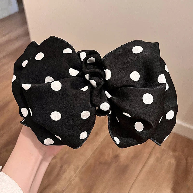 A collection of premium polka dot bow hair ties displayed on a clean surface