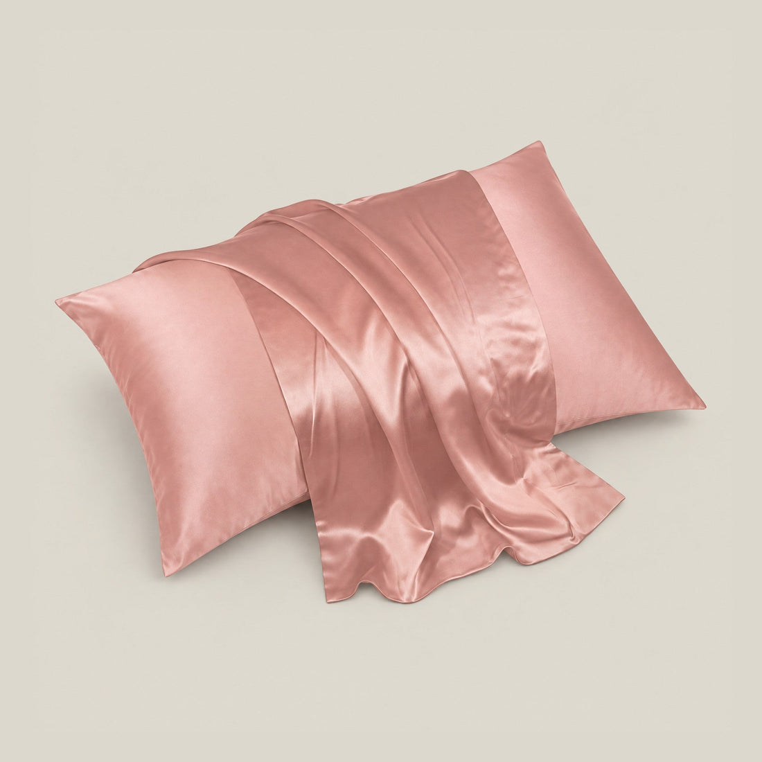 Rectangular silk pillowcase with blue, orange, and gray floral and butterfly pattern on a cream background, displayed flat