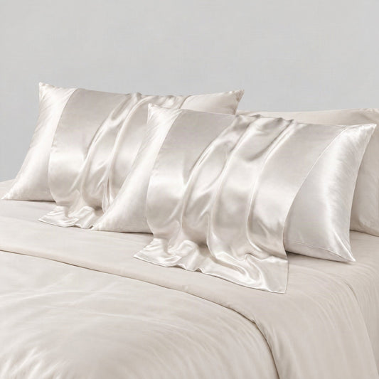 Ivory 22 momme mulberry silk pillowcases on a made bed