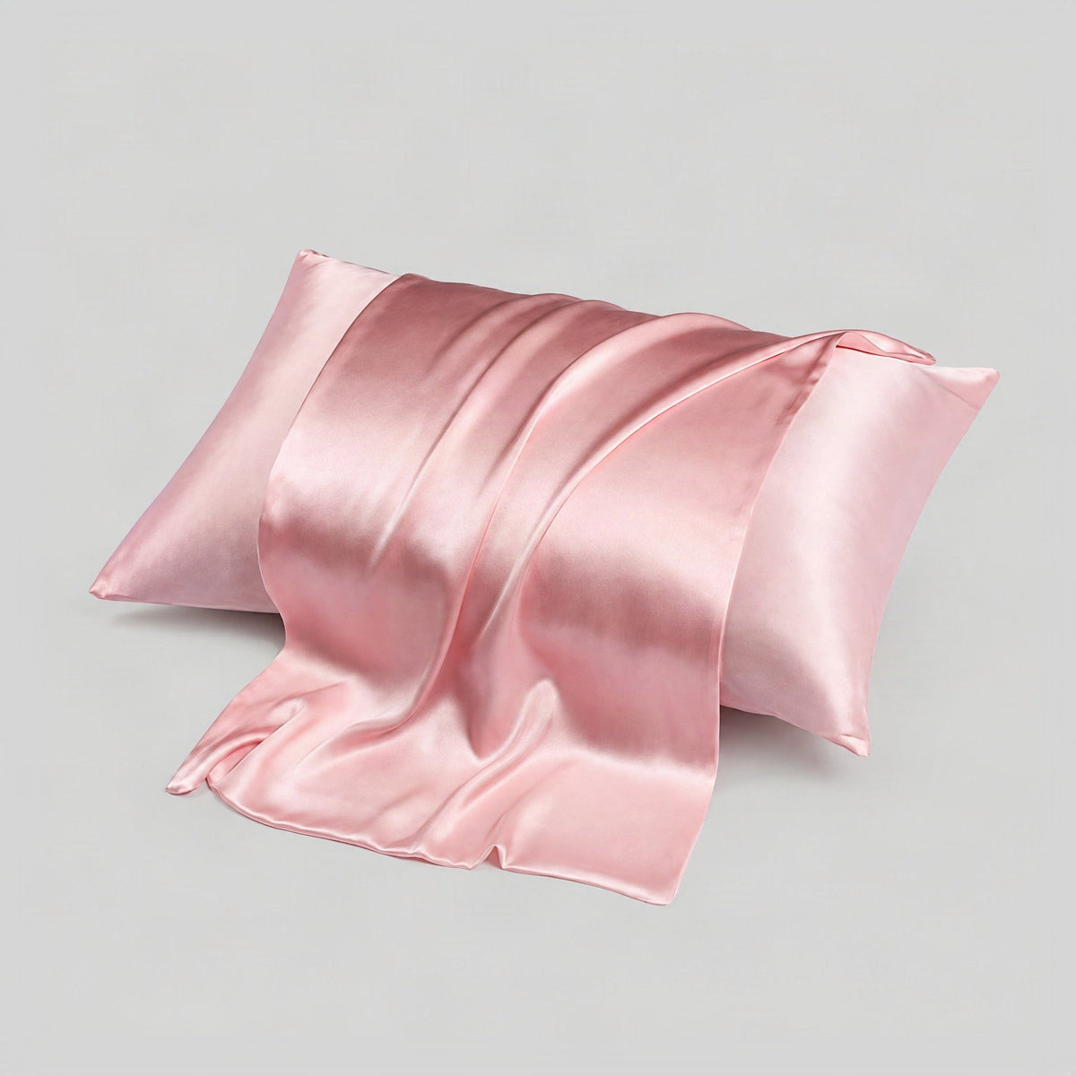 SuuSilk 16 Momme Mulberry Silk Pillowcase in a soft bedroom setting, showcasing its smooth double-sided finish and hidden zip