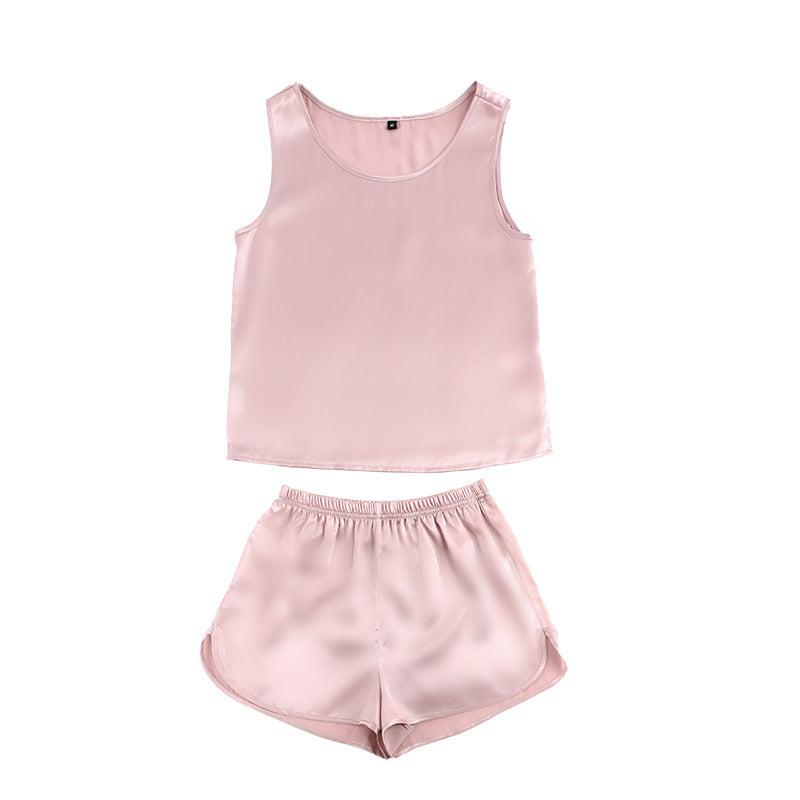 Flat lay of lotus pink silk tank and shorts set
