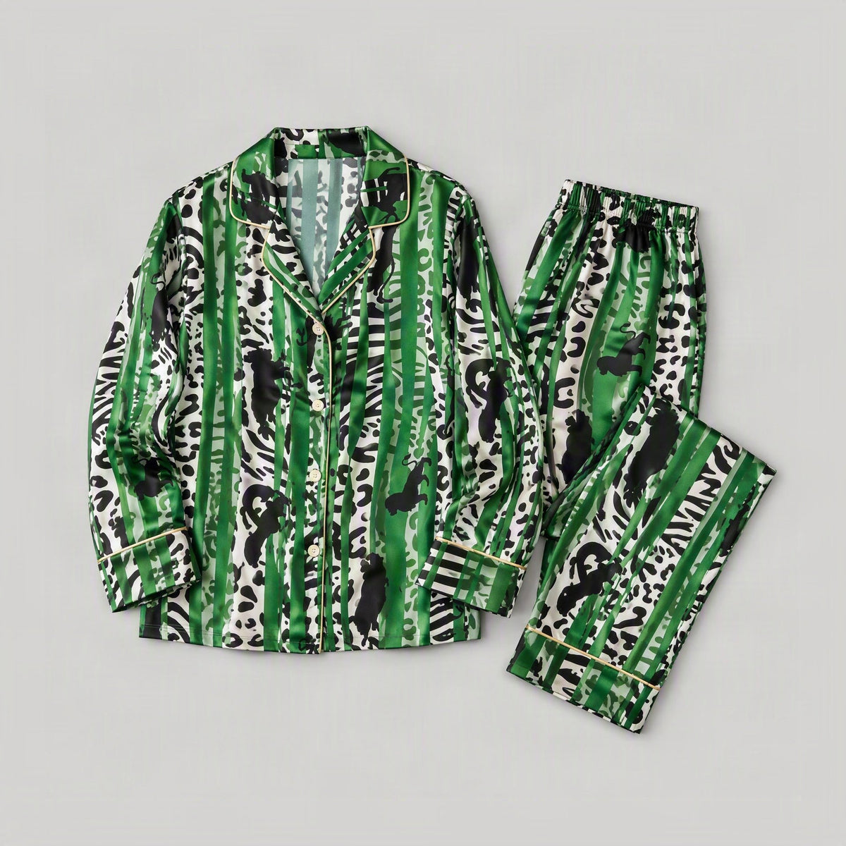 Green and black Oasis-print mulberry silk long-sleeve pajama set with gold piping, laid flat