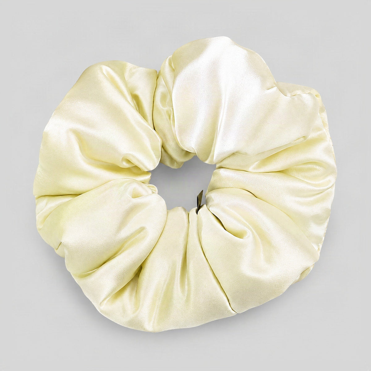 30 Momme Mulberry silk scrunchie with luxurious sheen, soft padded texture displayed on a neutral surface, gentle hair access
