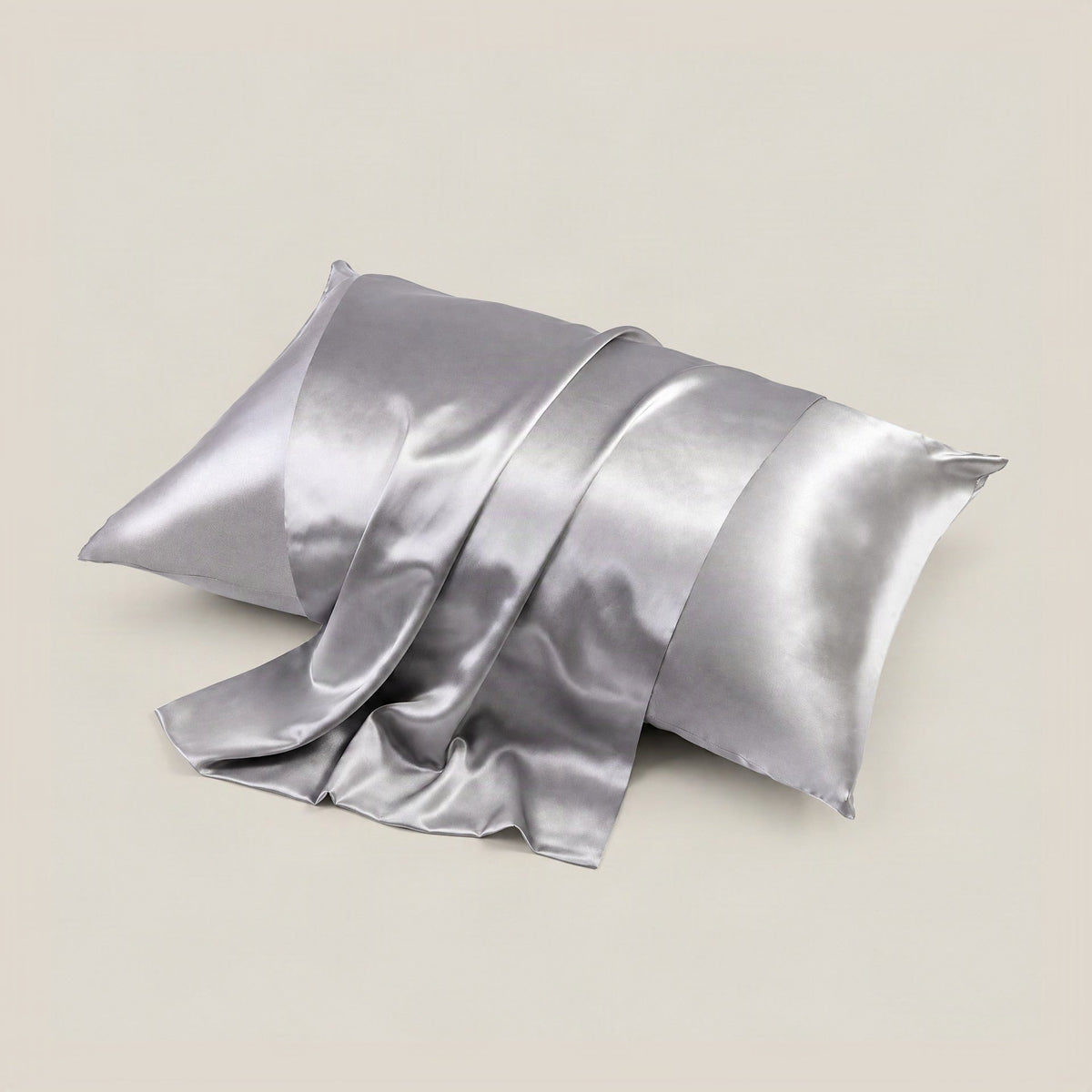 Glossy multicolour 22 Momme silk pillowcase draped on a bed, highlighting its satin weave sheen and hidden envelope closure d