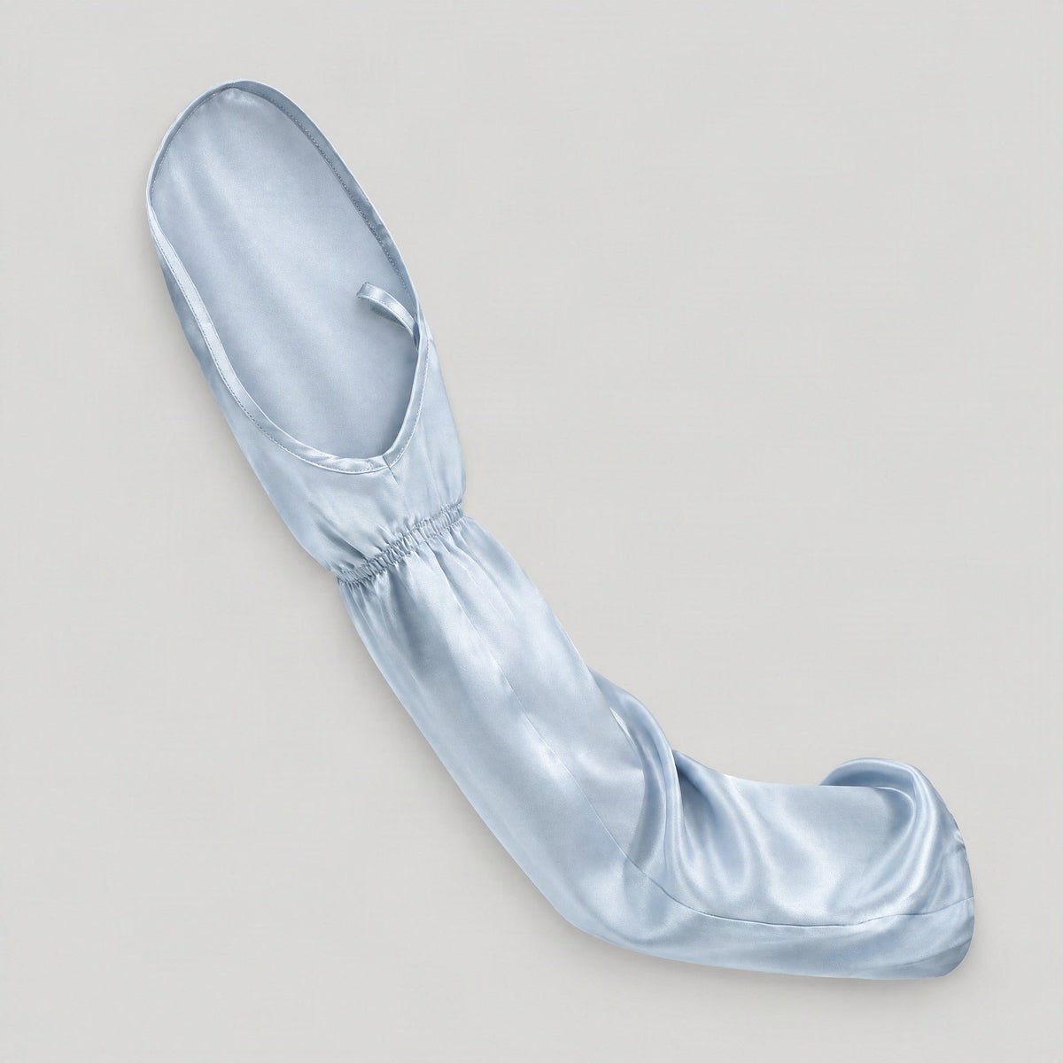 Single light blue mulberry silk UV arm sleeve with hand cover, laid flat