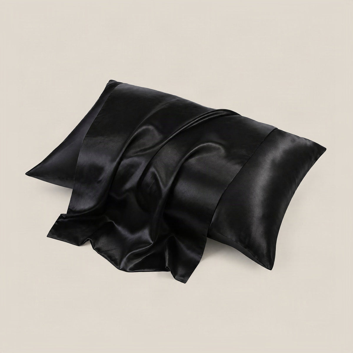 Woman resting her head on a glossy white SuuSilk 22 Momme mulberry silk pillowcase in a softly lit bedroom setting.