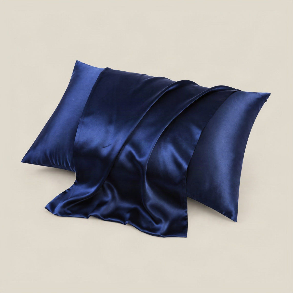 Ivory 19 Momme silk pillowcase with hidden zipper neatly arranged on a bed with soft natural lighting