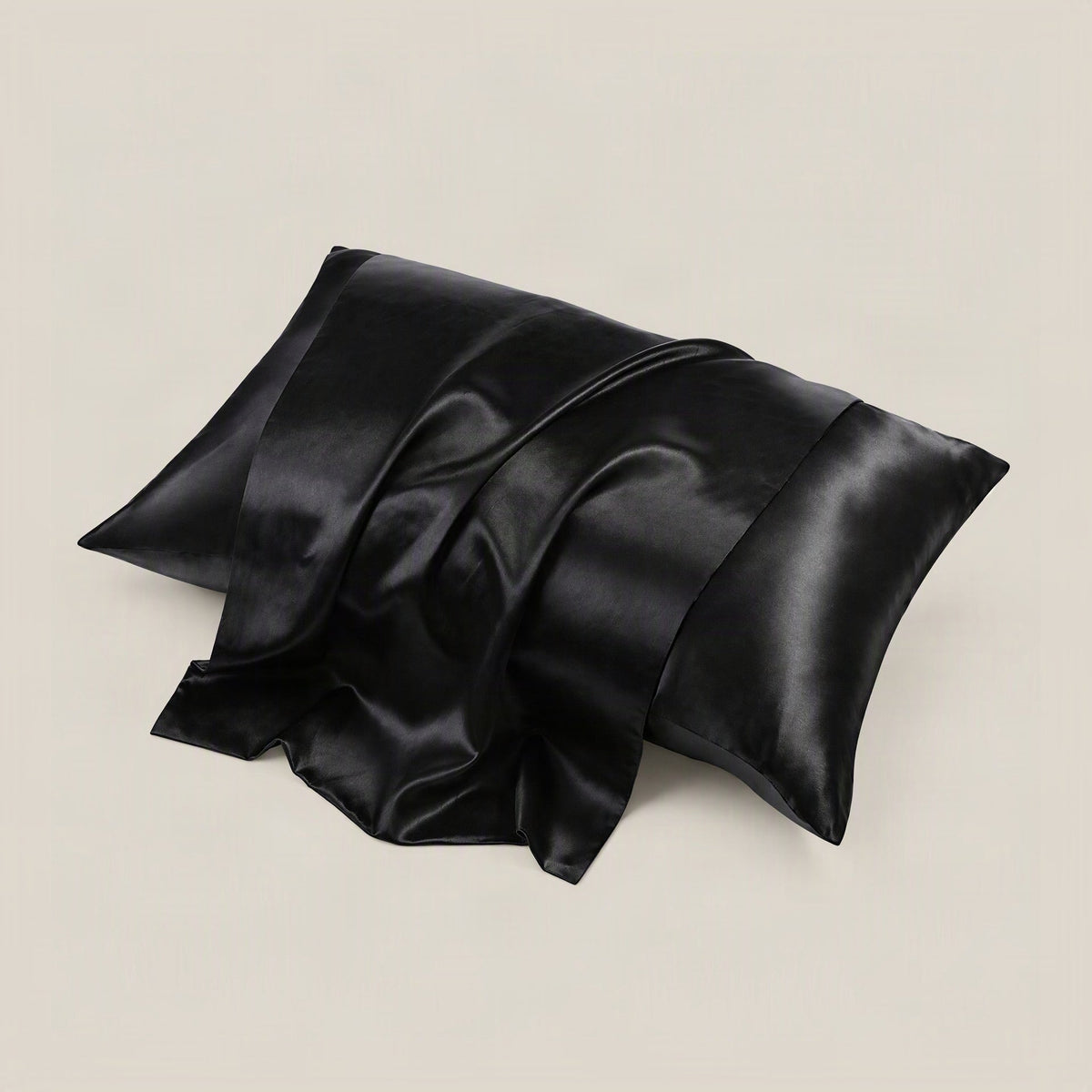 SuuSilk 22 Momme glossy mulberry silk envelope pillowcase in soft pastel color, displayed on a styled bed setting