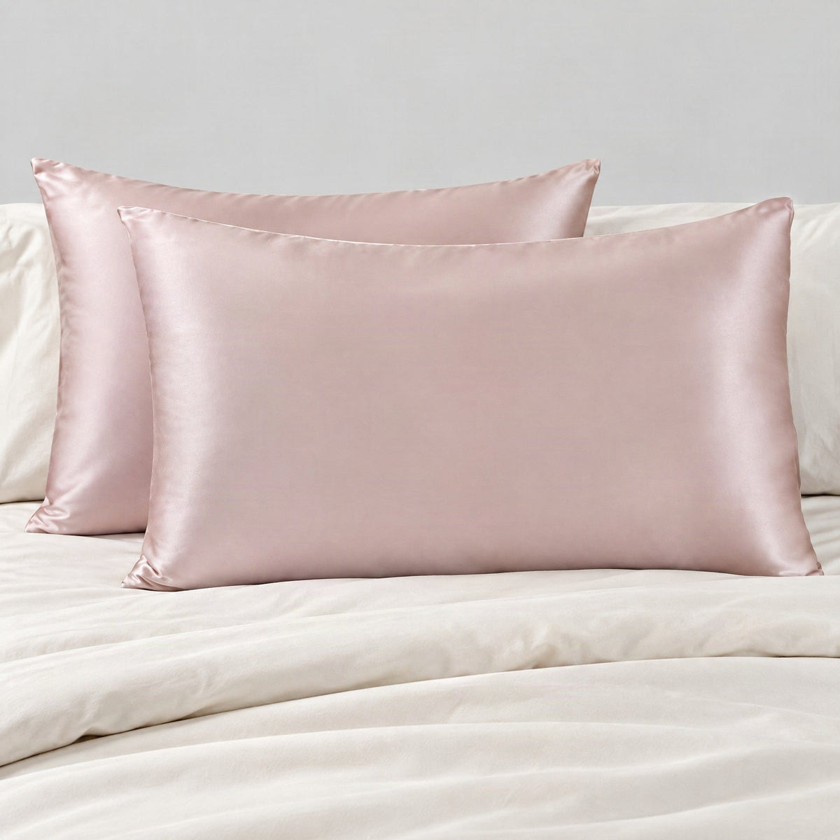 White Silk pillowcase with envelope closure styled on a minimalist bed, showcasing smooth mulberry silk texture and elegant d