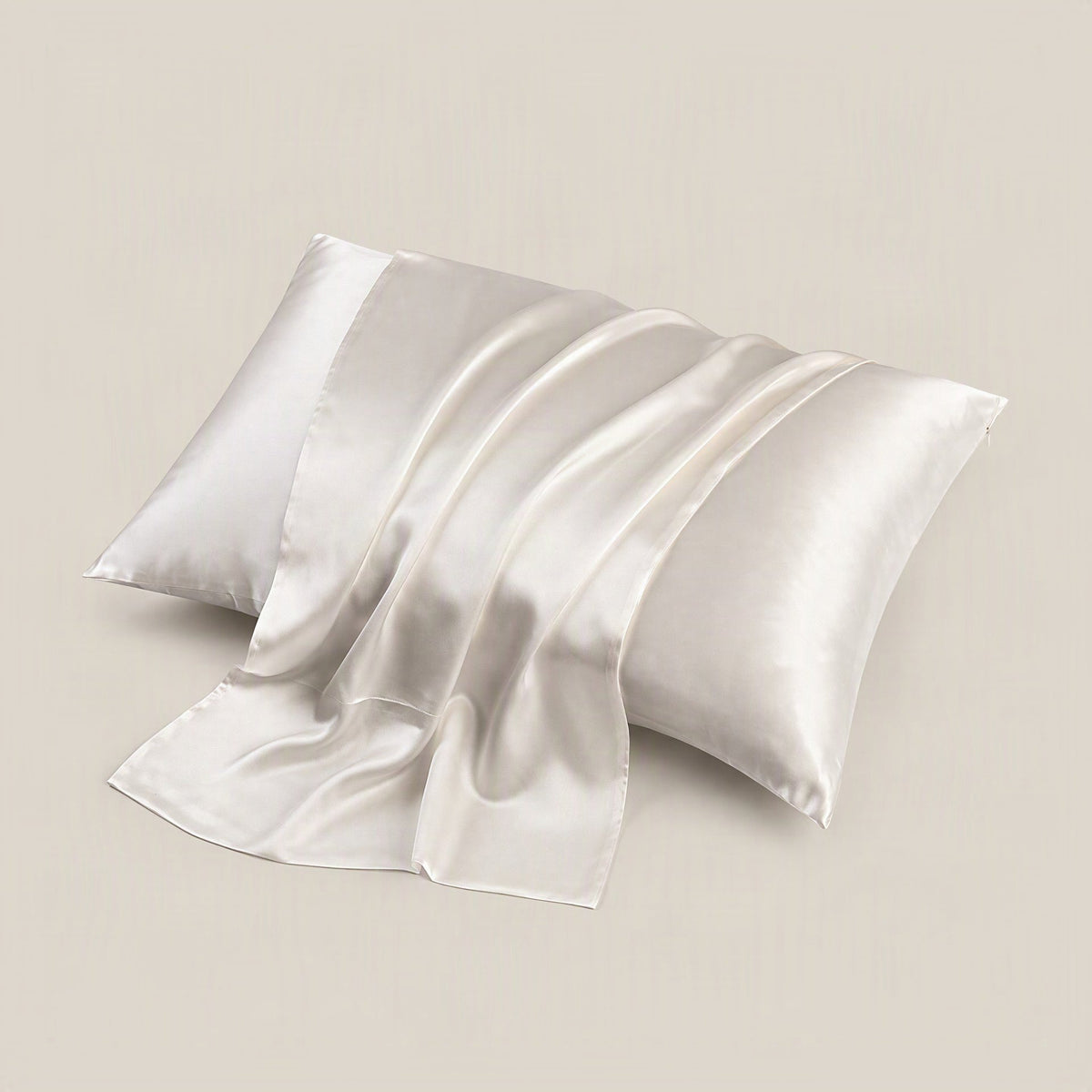 SuuSilk 19 Momme silk pillowcase in blush pink, neatly placed on a bed with neutral linen bedding, showcasing its smooth mulb