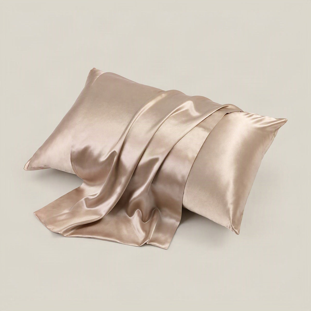 Glossy 22 Momme double-sided silk pillowcase with hidden zipper, displayed in a soft bedroom setting