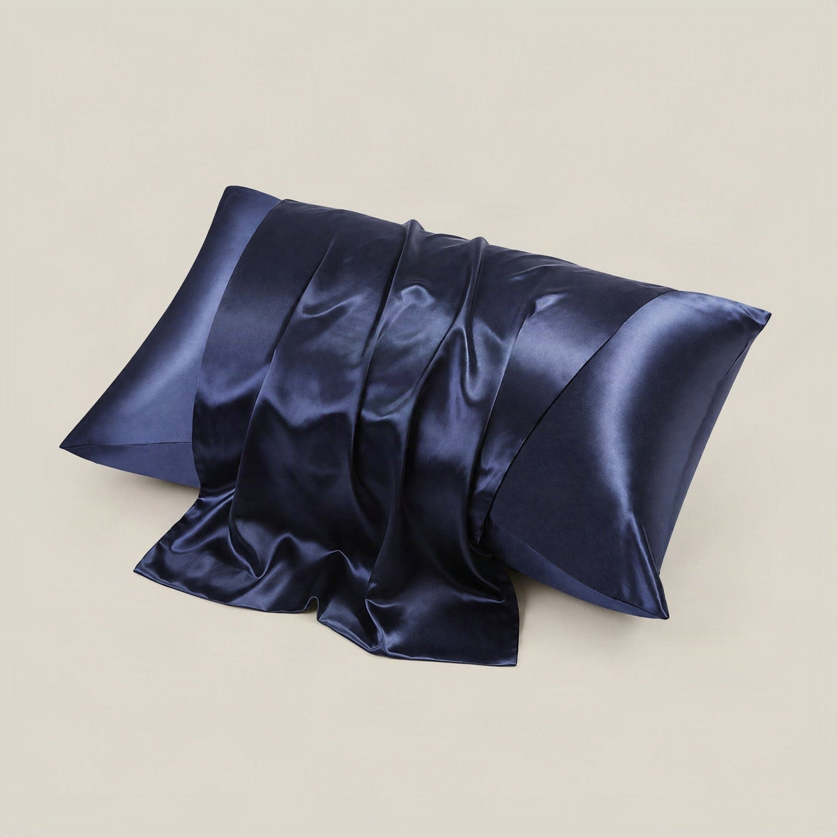 White 22 Momme glossy mulberry silk pillowcase with hidden zipper on a neatly made bed in soft natural light.