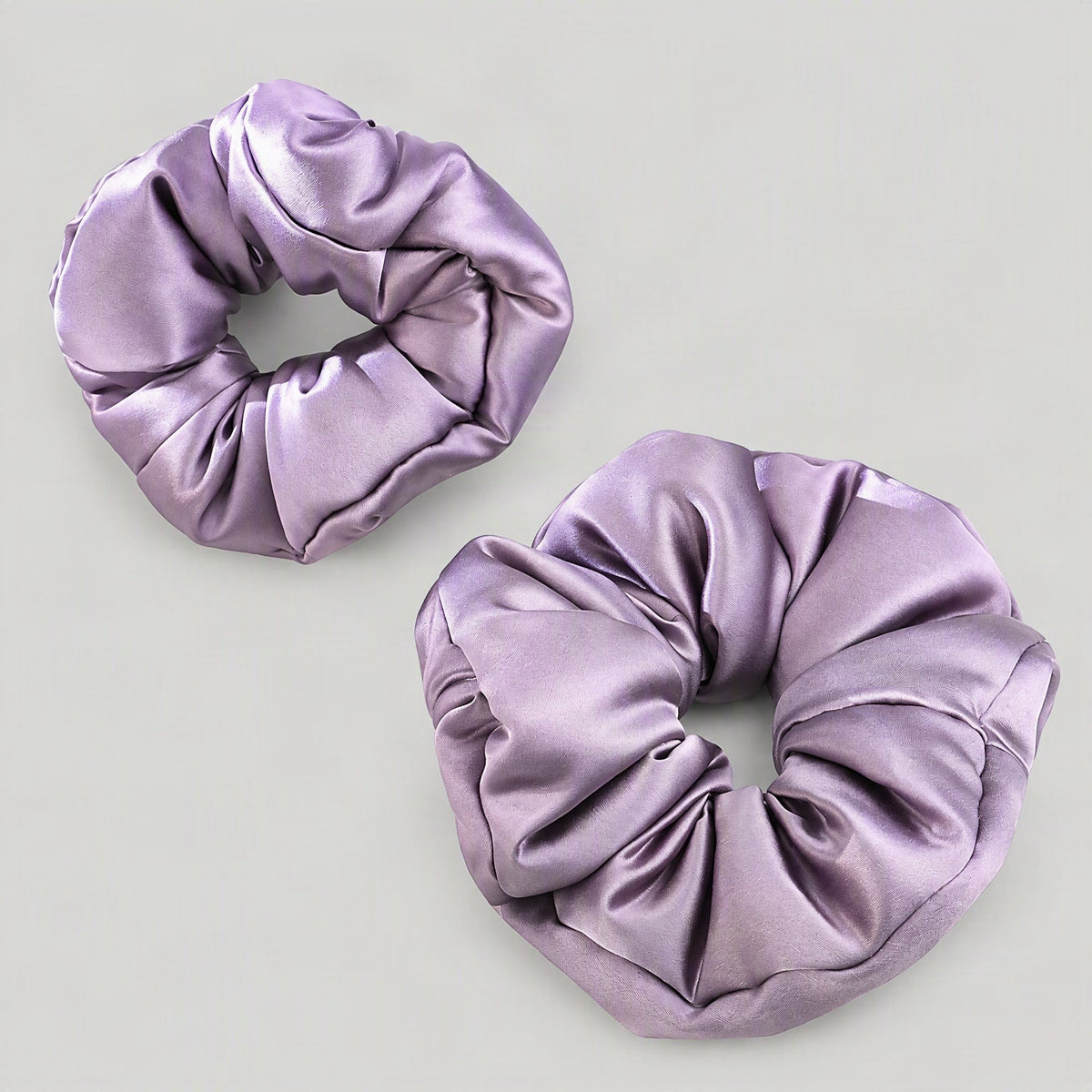 SuuSilk 30 Momme padded mulberry silk scrunchie in soft cream, shown draped casually for everyday hair styling.