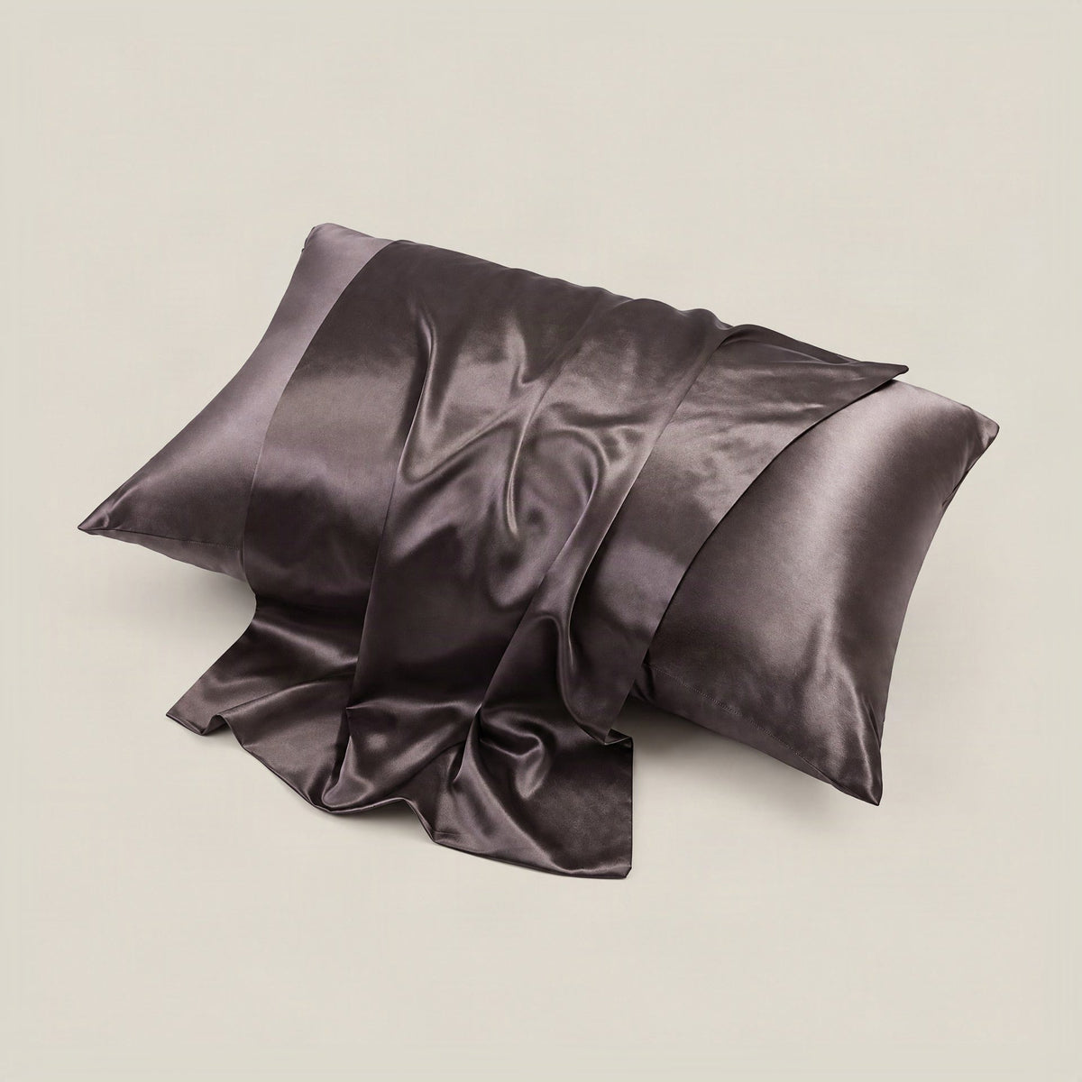 SuuSilk 22 Momme glossy mulberry silk pillowcase with hidden zipper in soft pastel color, displayed on a styled bed