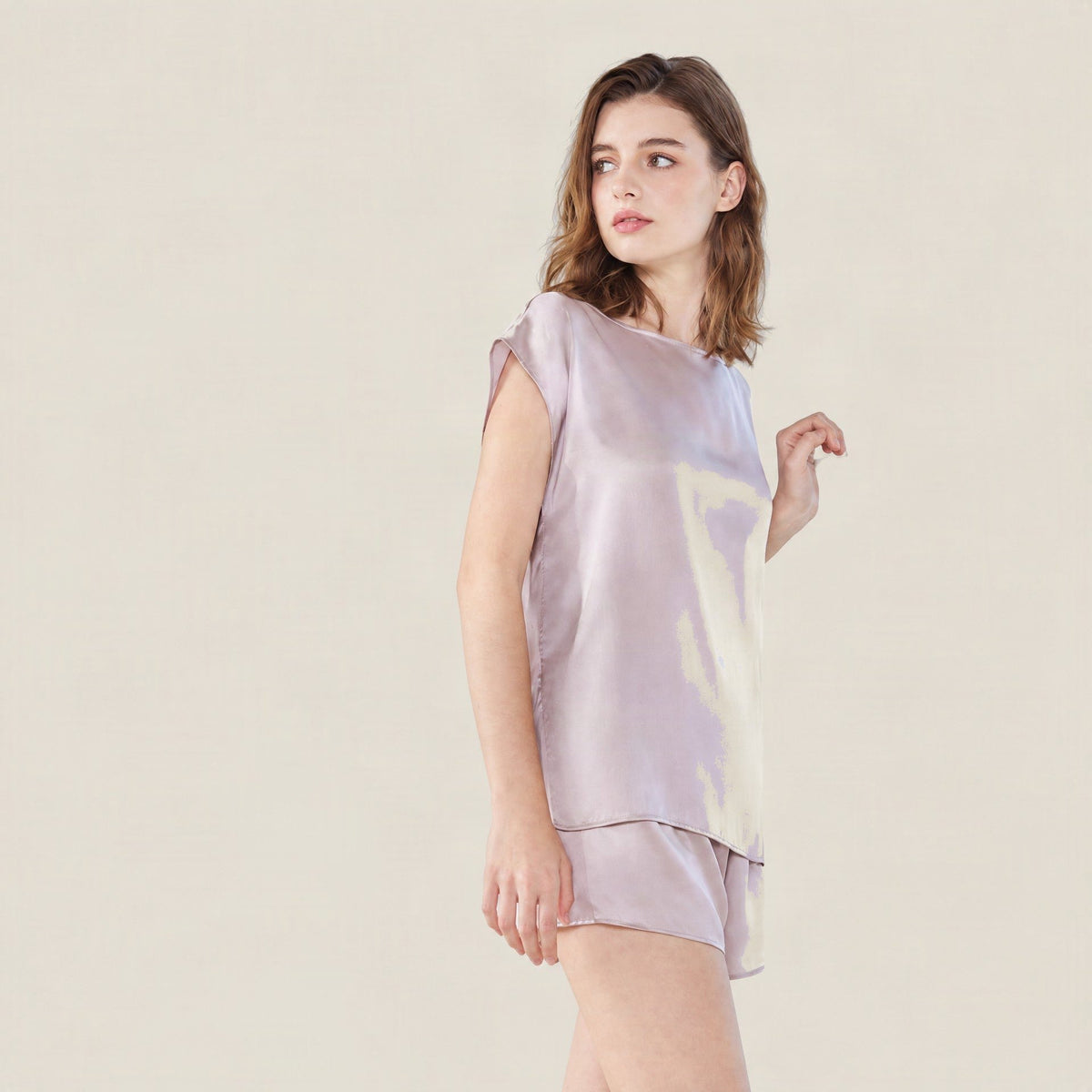 Lilac mulberry silk sleeveless top and shorts set with an abstract cream print, side view on a model