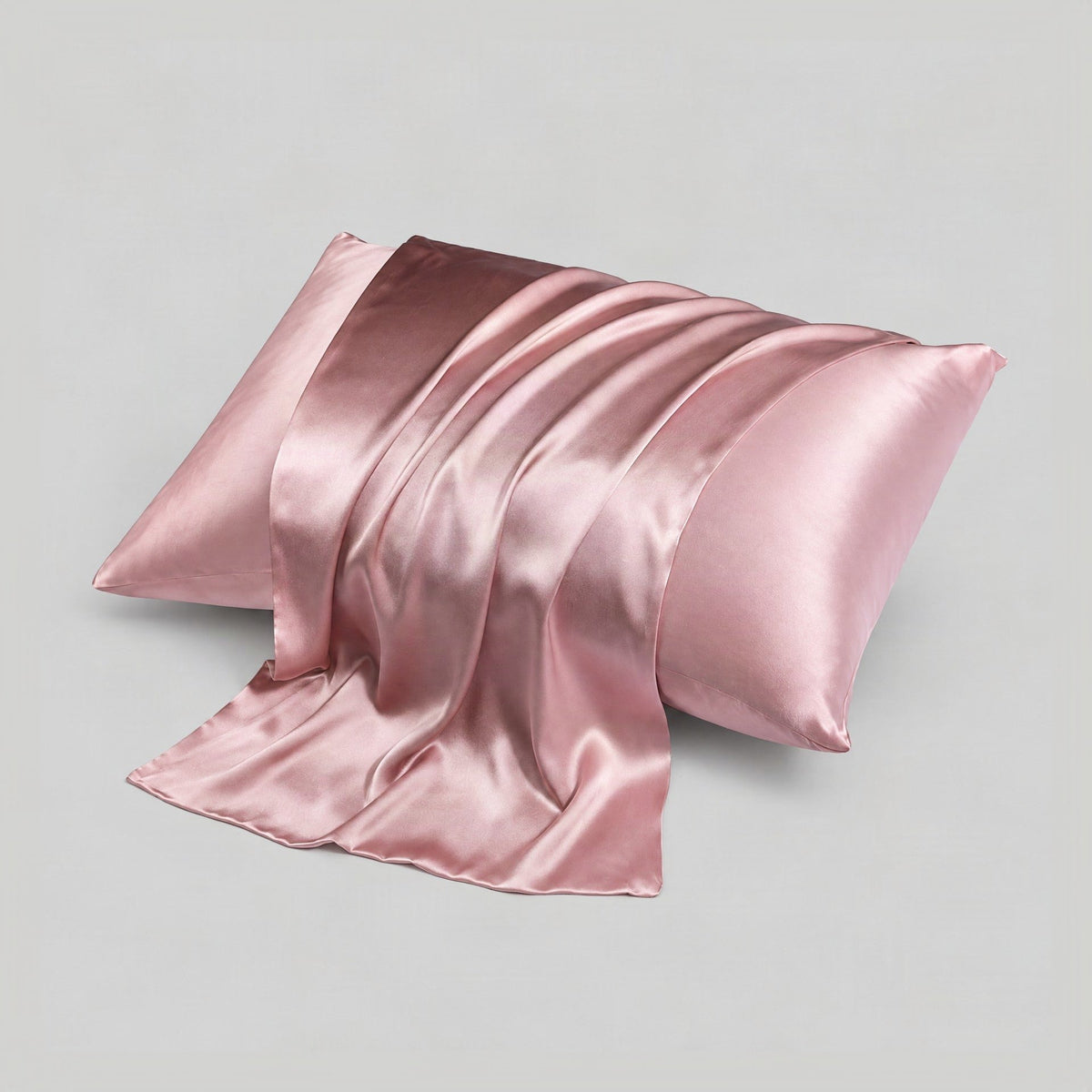 SuuSilk 16 Momme 6A grade double-sided mulberry silk pillowcase with hidden zipper, displayed folded in a soft, elegant setti