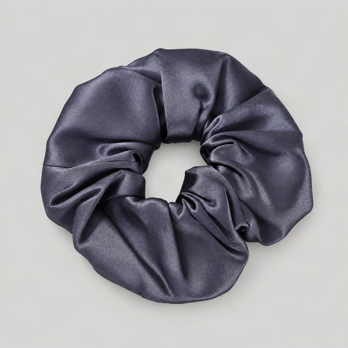 SuuSilk 30 Momme mulberry silk scrunchie styled in loose hair, showcasing smooth lustrous texture and gentle everyday wear ap