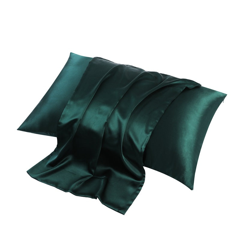 Emerald green silk pillowcase showing soft folds and sheen