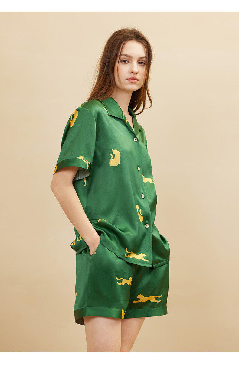 Back pocket detail on dark green silk shorts