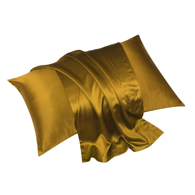 Gold silk pillowcase with warm golden tones