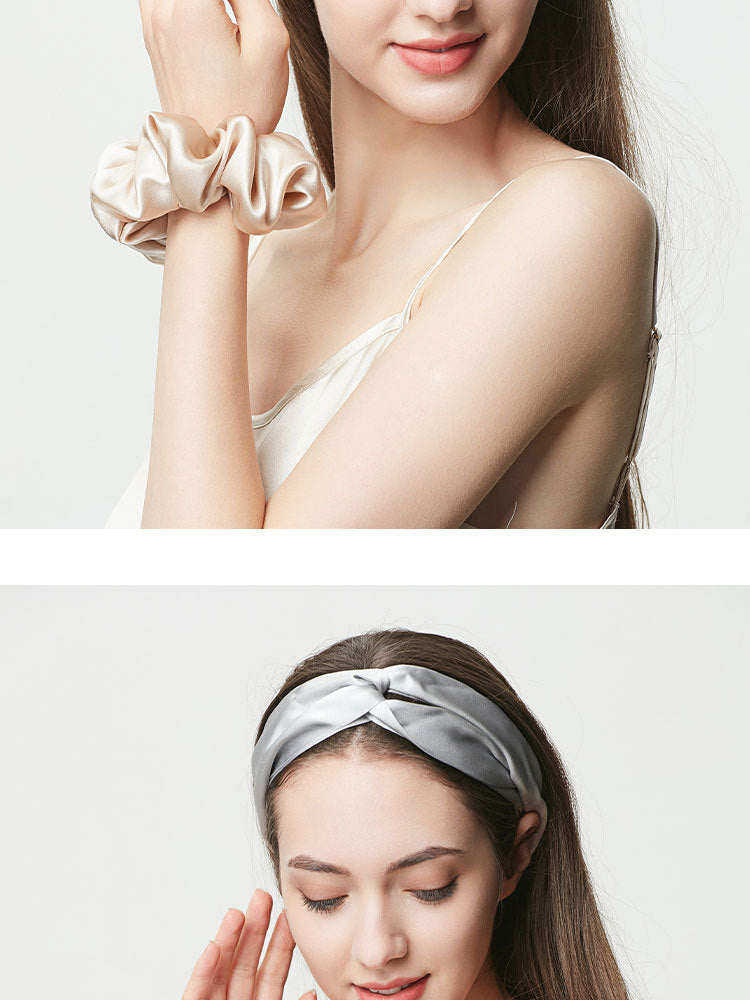 Silver gray silk hair scrunchie worn on wrist, paired with matching headband below