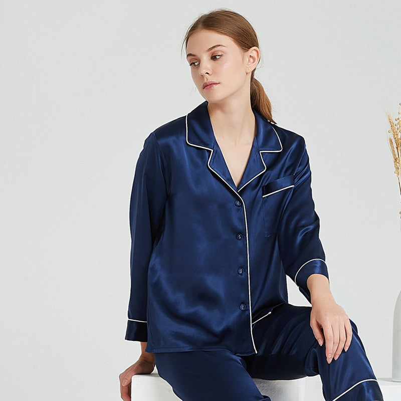 Deep navy silk pajama set with contrast trim detail on collar and cuffs