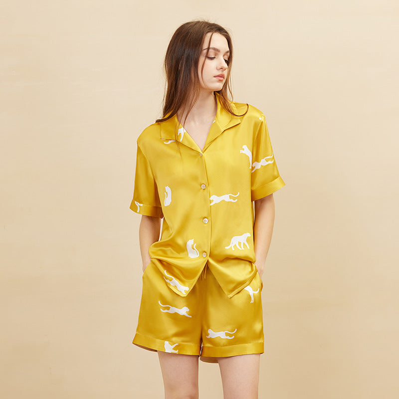 Gold leopard print silk pajama set front view on white background
