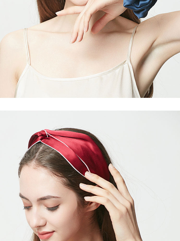Wine red silk headband with piped edge worn by woman with eyes closed