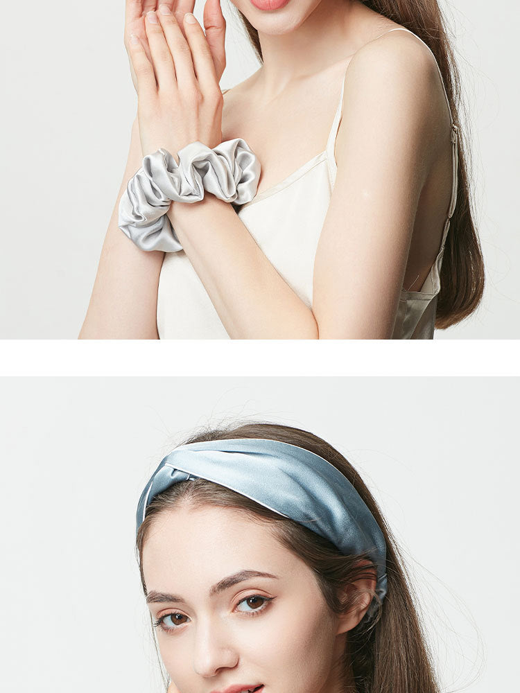 Mist blue silk hair scrunchie on wrist and matching mist blue headband worn by woman