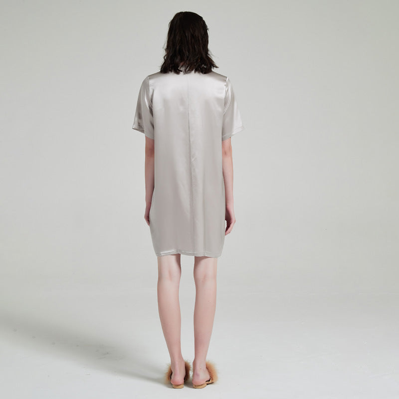 Three-quarter back view showing silk drape and short sleeves