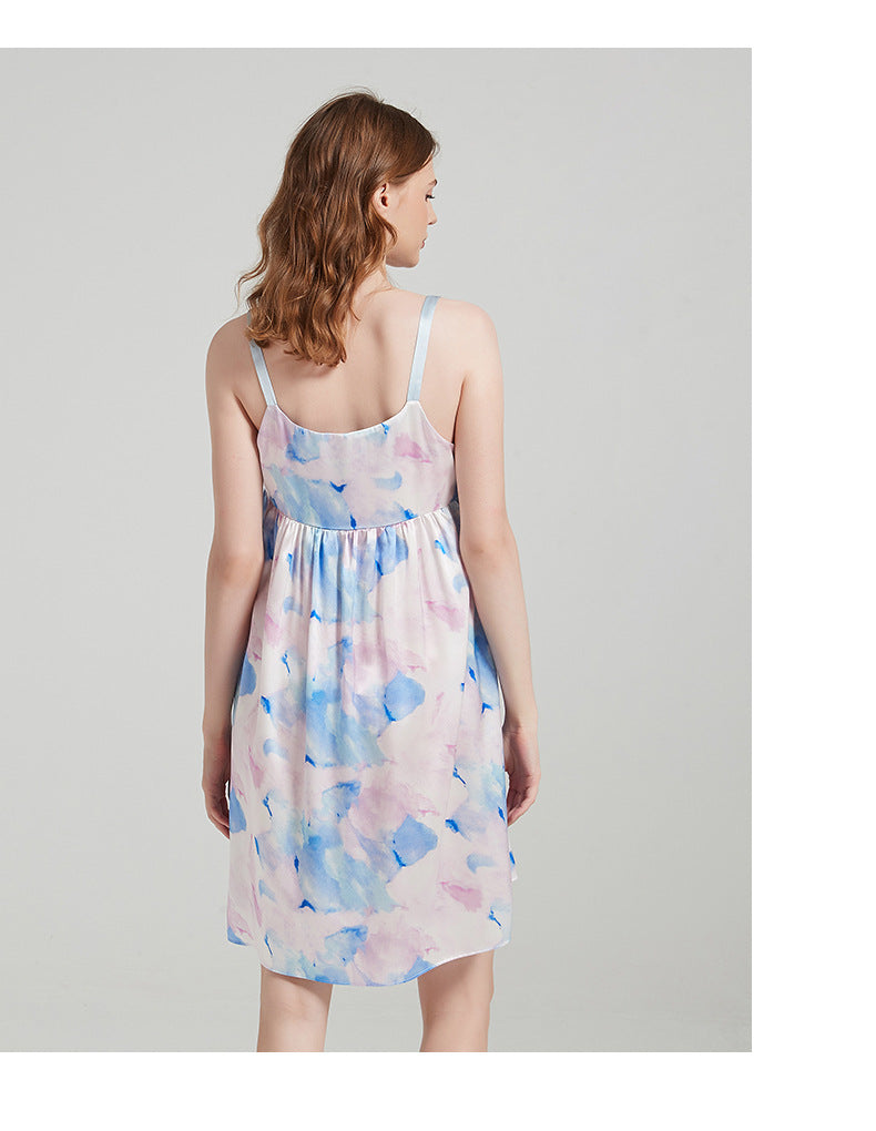 Flat lay of watercolor silk cami dress displaying the full print