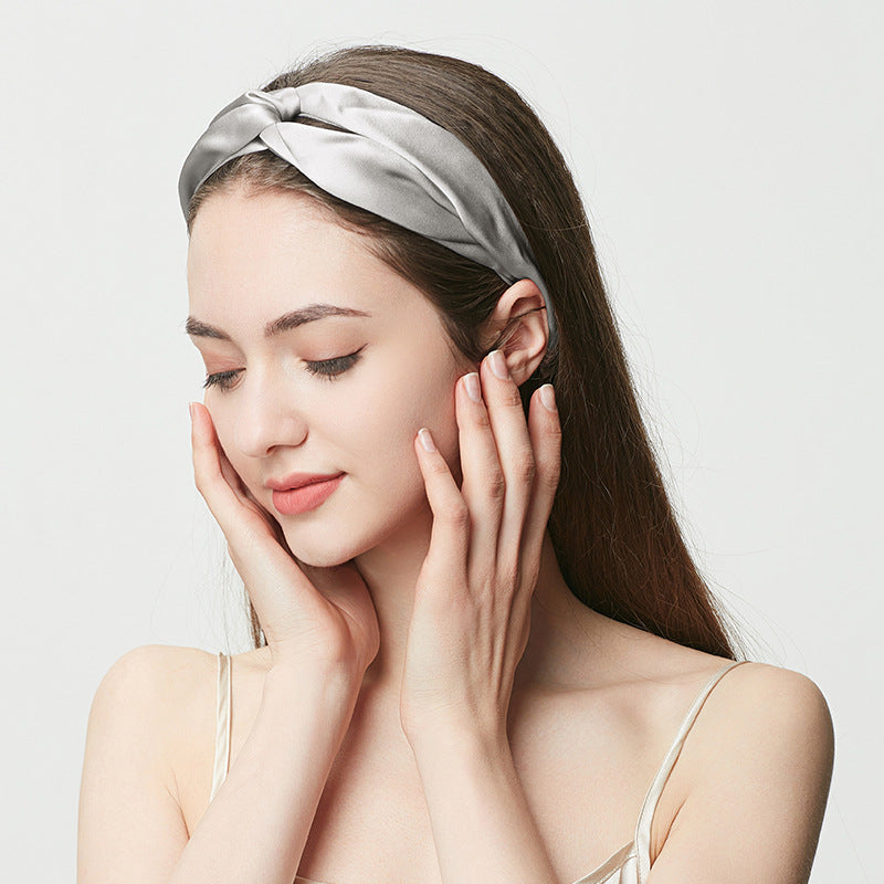 Silver gray silk headband with twisted knot, woman wearing the headband
