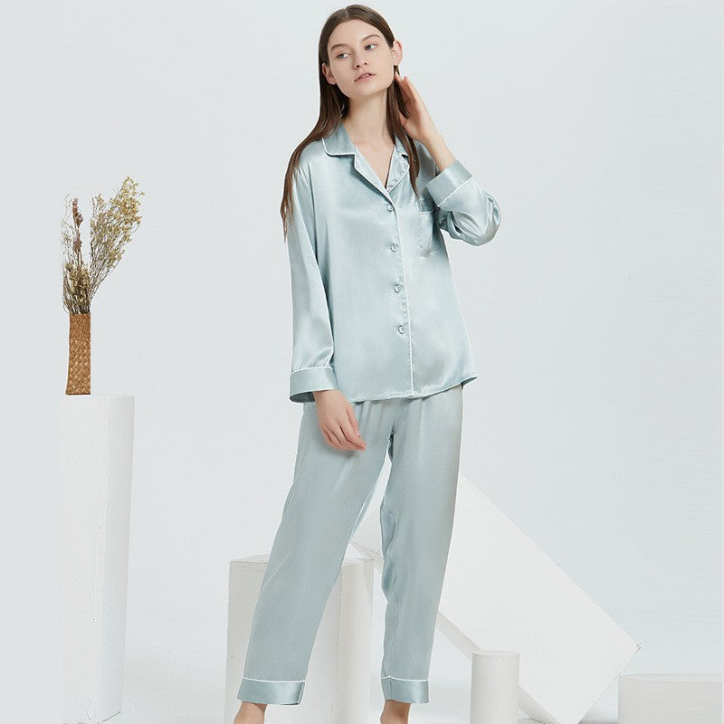Full-length view of mint green silk pajama set on a model