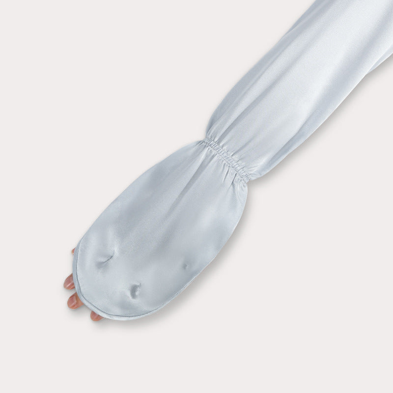 Pair of sleeves folded, showing elasticity and length
