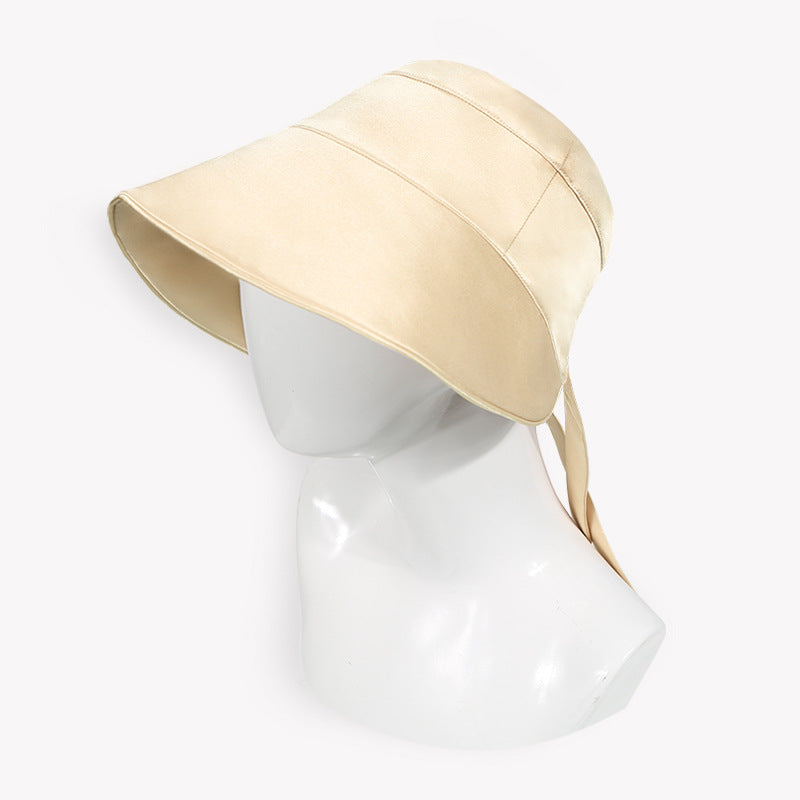Side profile of silk sun hat showing brim curve