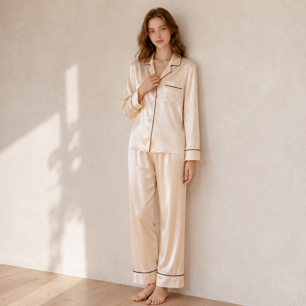 Light apricot silk pajama set front view in sunlight