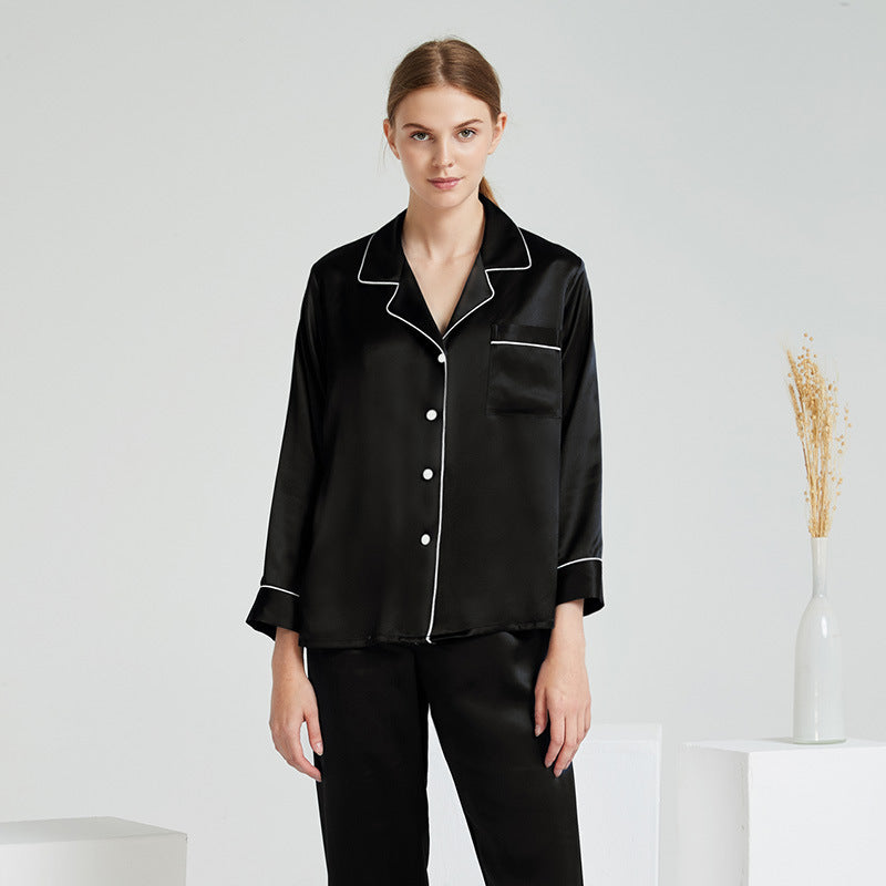 Front view of black silk pajama set with notched collar detail