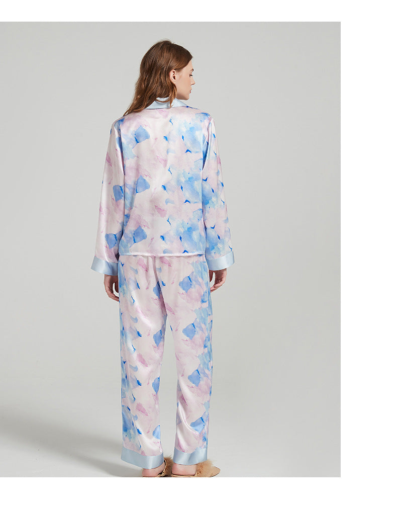 Packaging shot of the silk pajama set in a gift box with tissue paper