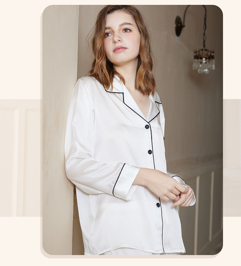 Rear view of the silk pajama set showing the relaxed straight-leg fit