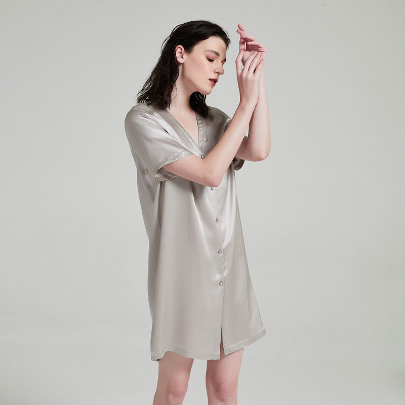 Close-up of collarless V-neckline on silk loungewear dress