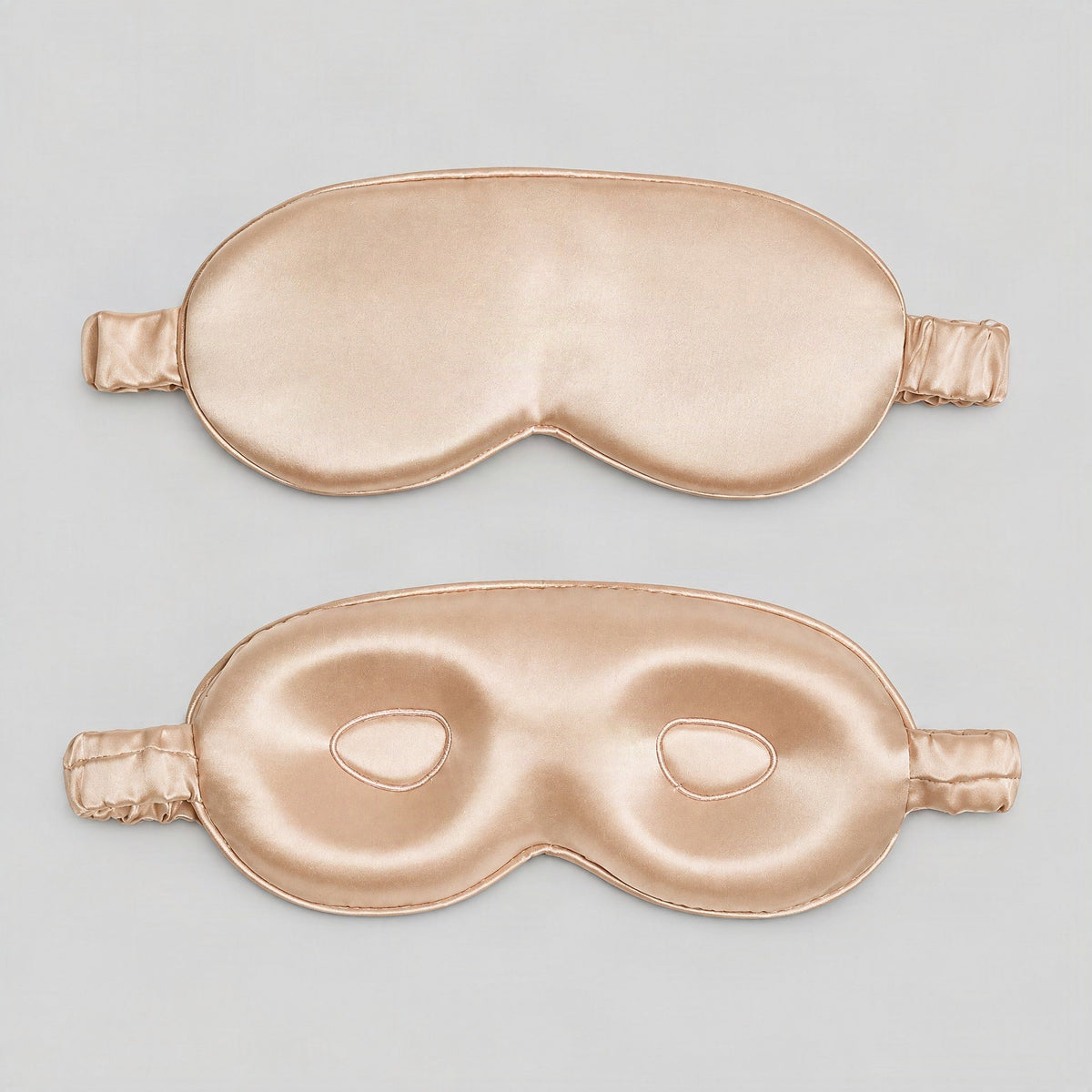 SuuSilk 19 Momme 3D contoured mulberry silk eye mask resting on soft linen, showcasing breathable luxurious fabric texture.