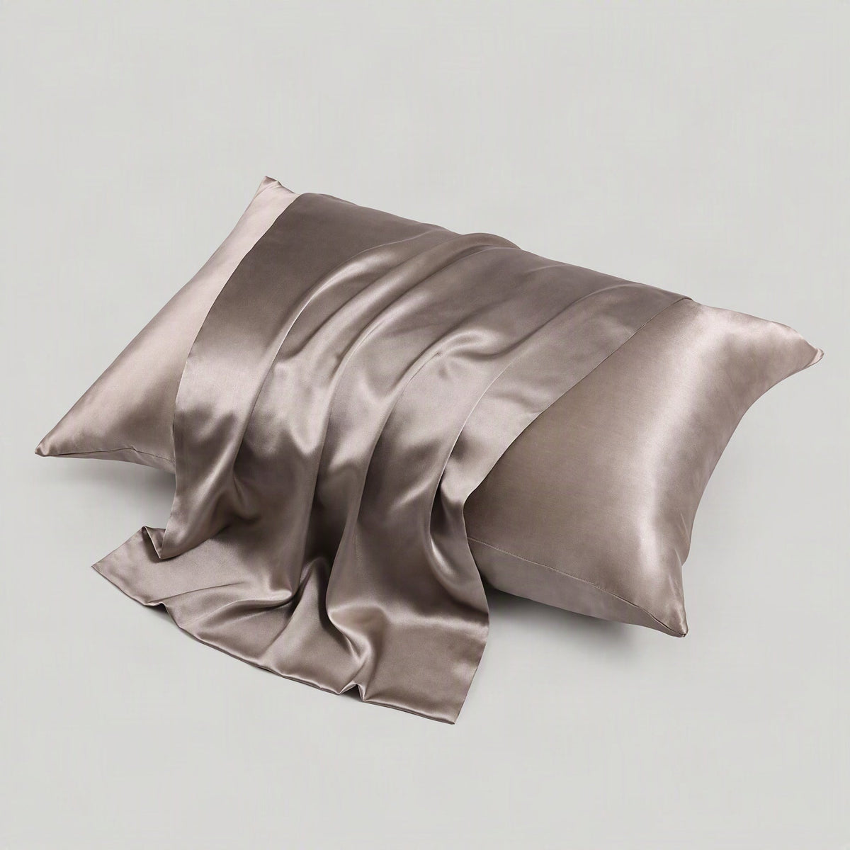 Multicolour 22 Momme matte silk envelope pillowcase by SuuSilk styled on a bed with hidden closure detail visible