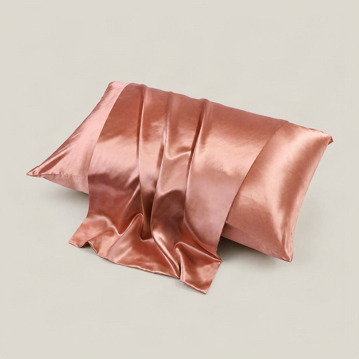 SuuSilk 22 Momme glossy mulberry silk pillowcase with hidden zipper, shown in a soft lifestyle setting