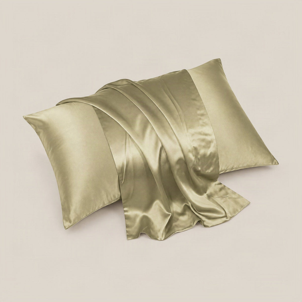 SuuSilk 30 Momme mulberry silk pillowcase draped on a bed, showcasing its smooth texture and hidden zipper detail