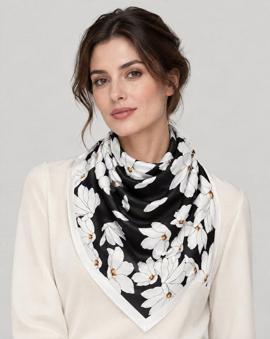 Black White Falling Petals Mulberry Silk Square Scarf – 21 x 21 in, worn tied at the neck over a cream top