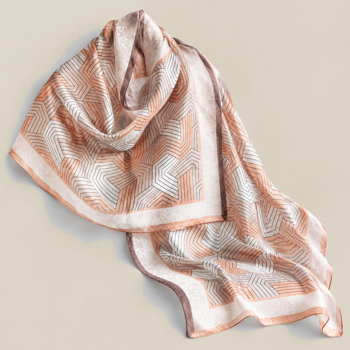 Orange linear print mulberry silk scarf detail showing silk texture and print